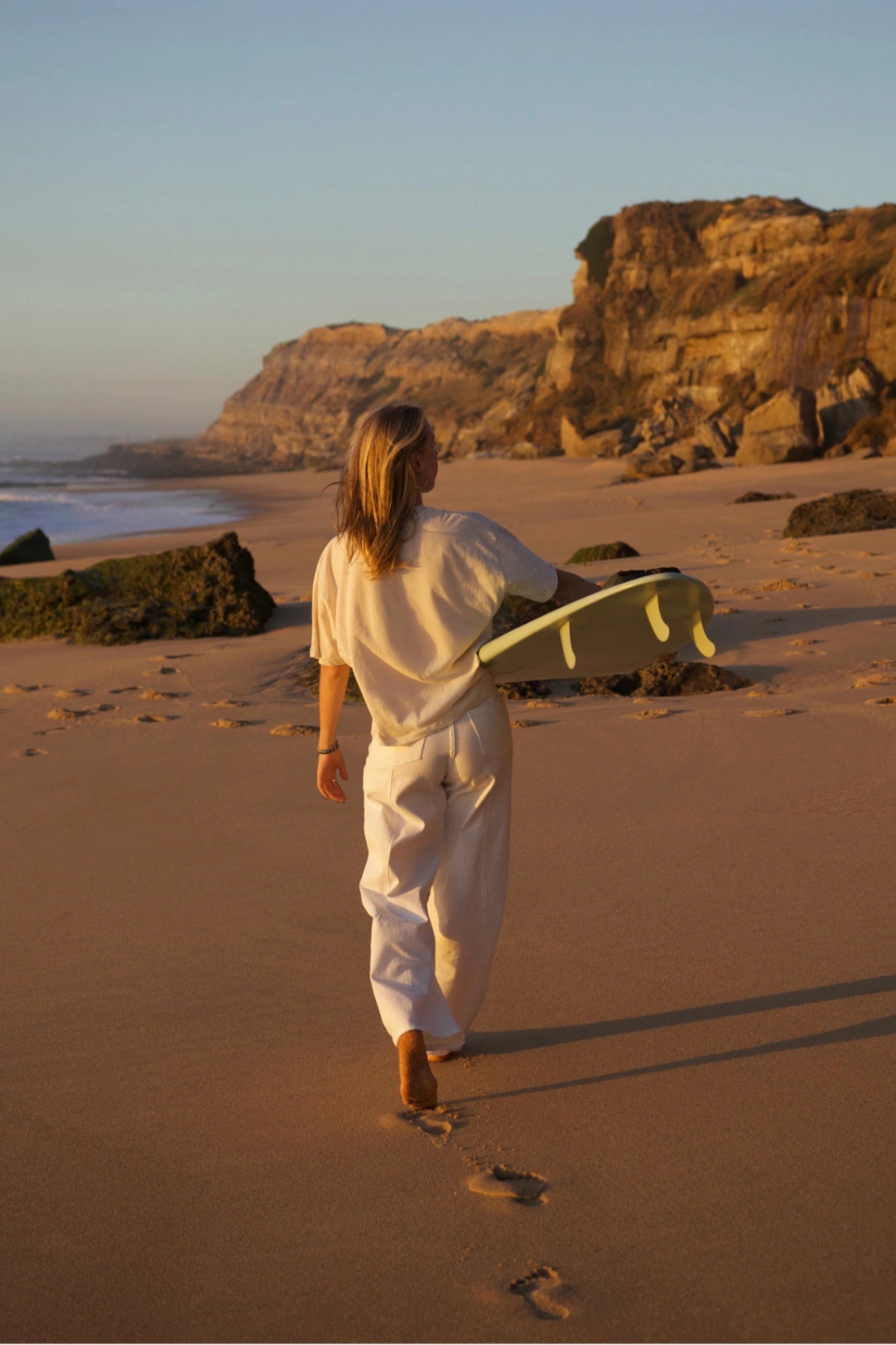 SUNKISSED Short T-Shirt Natural Raw back view beach walk surfboard