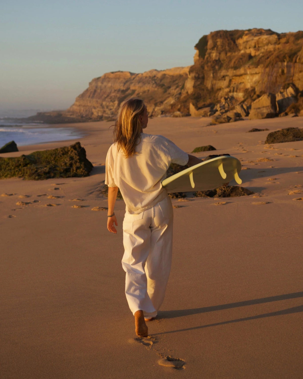 SUNKISSED Short T-Shirt Natural Raw back view beach walk surfboard
