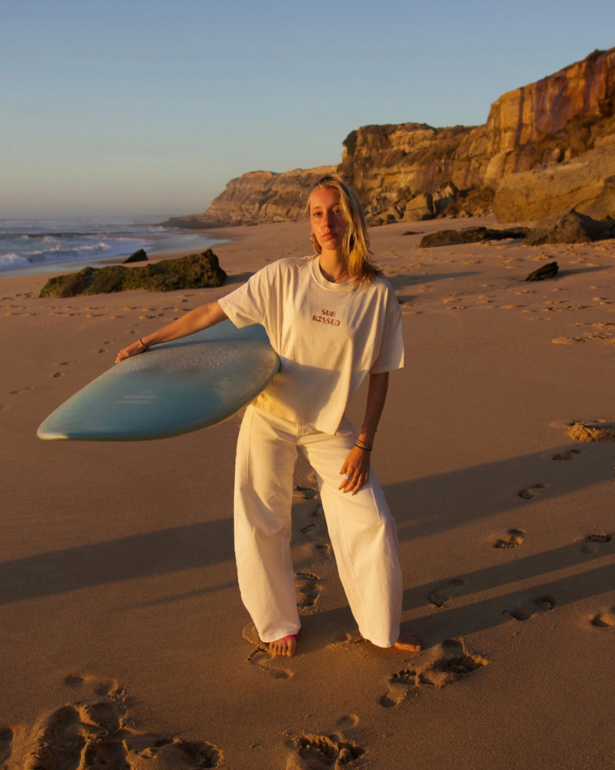 SUNKISSED Short T-Shirt Natural Raw model standing beach sunset