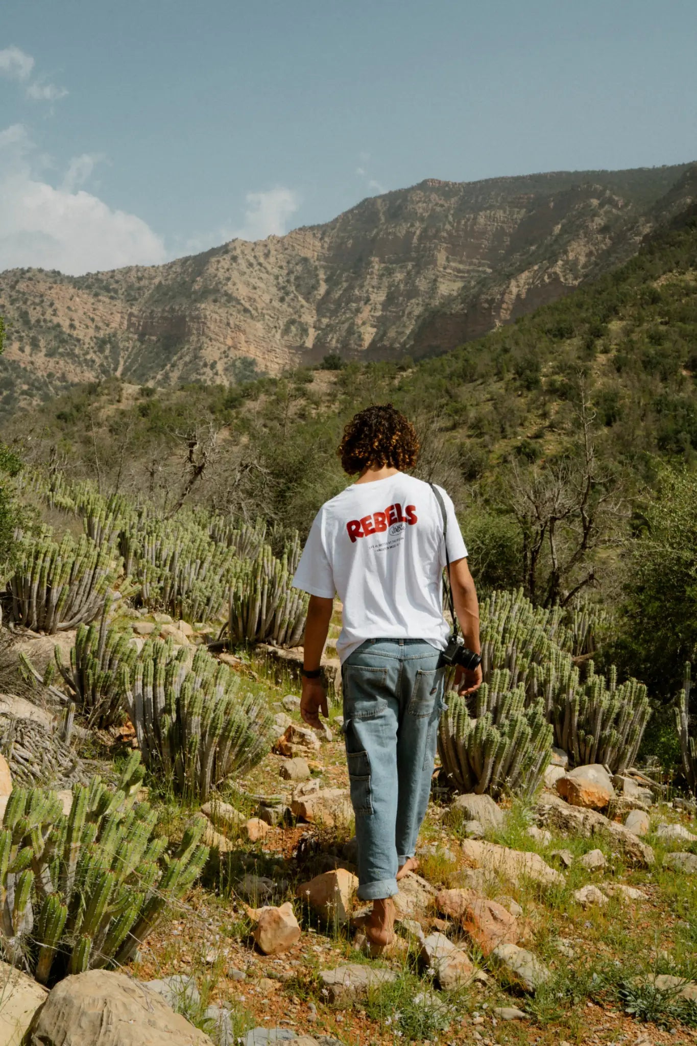 Rebels Surf Wear oversized t-shirt white back view mountain desert lifestyle