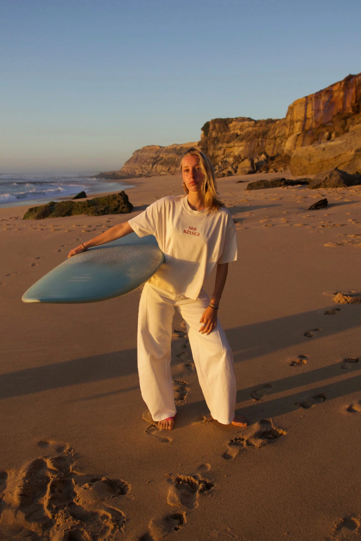 SUNKISSED Short T-Shirt Natural Raw model standing beach sunset